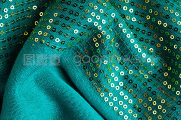 绿色亮片背景抽象纹理布料波浪形褶皱纺织品